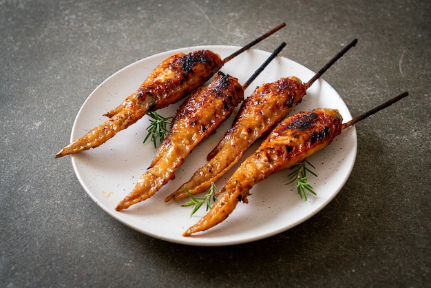 grilled or barbecue chicken wings skewer on plate