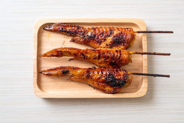 grilled or barbecue chicken wings skewer on plate