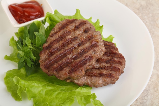 Grilled beef burger cutlet with sauce