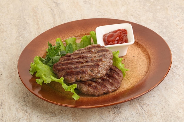 Grilled beef burger cutlet with sauce