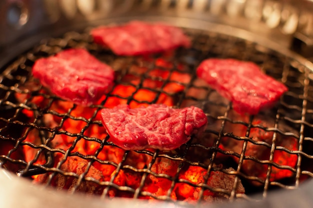 Grilled beef or pork meat grilled on charcoal grill Cooking yakiniku Japanese style