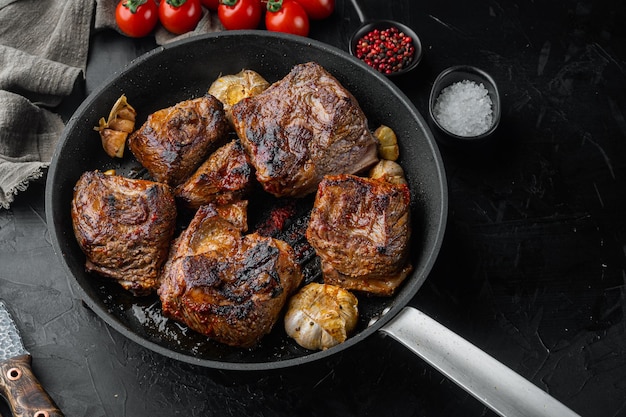 Grilled beef short rib set, on black stone background