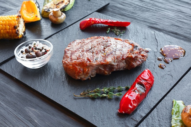 Grilled beef steak and roasted vegetables