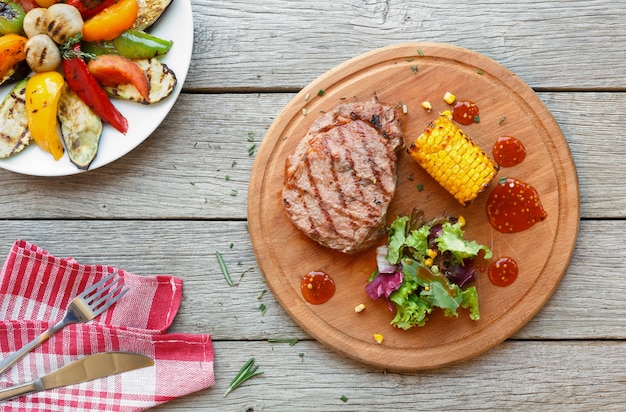 Grilled beef steak and roasted vegetables