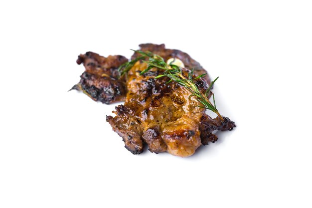 Grilled beef steak and rosemary isolated on white background