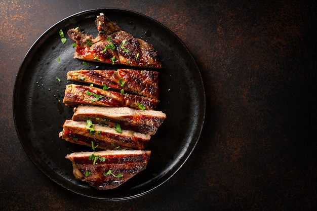 Grilled beef steak served on plate