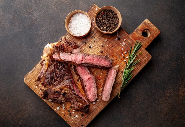 grilled beef steak with spices on a stone