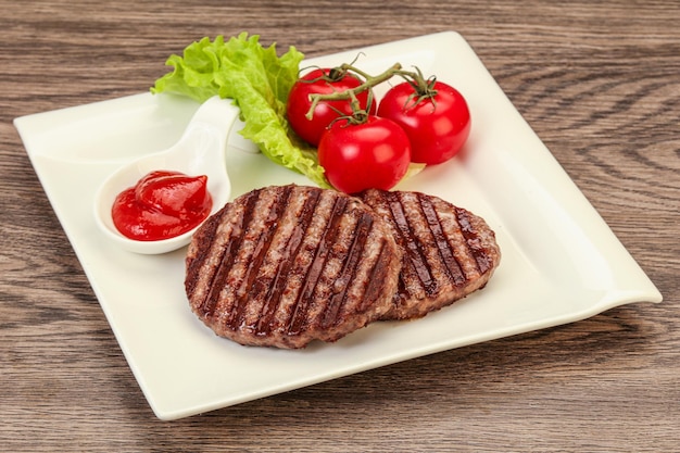 Grilled burger cutlet with sauce