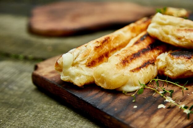 Grilled cheese puff pastry on the wooden cutting board