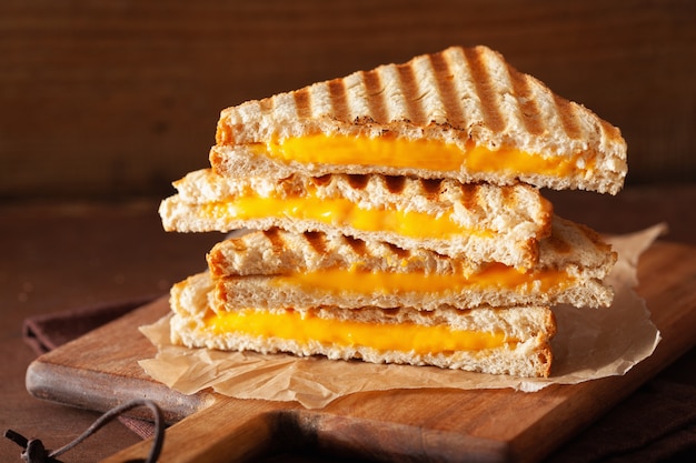 Grilled cheese sandwich on rustic brown background