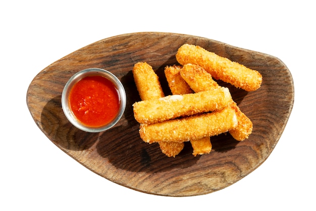 Grilled cheese sticks with red sauce, served on a wooden board