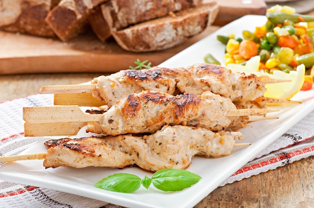 Grilled chicken on bamboo skewers