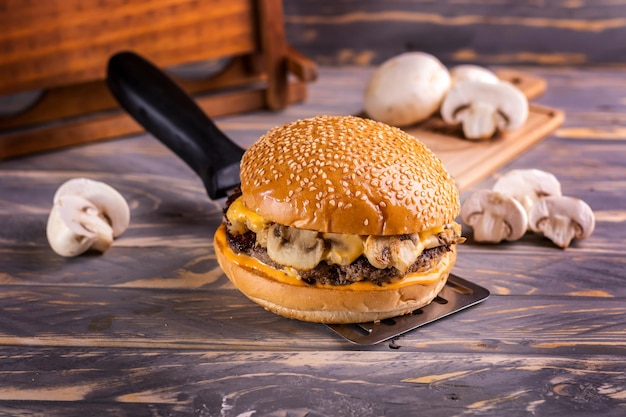 Grilled Chicken BBQ Sandwich isolated on cutting board top view on dark background american fast food