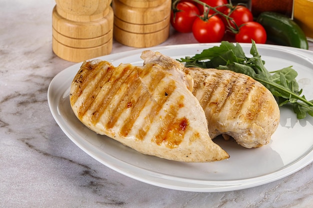 Grilled chicken breast served arugula