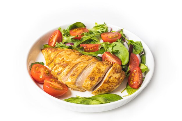 Grilled chicken breast with geen salad from fresh vegetable salad