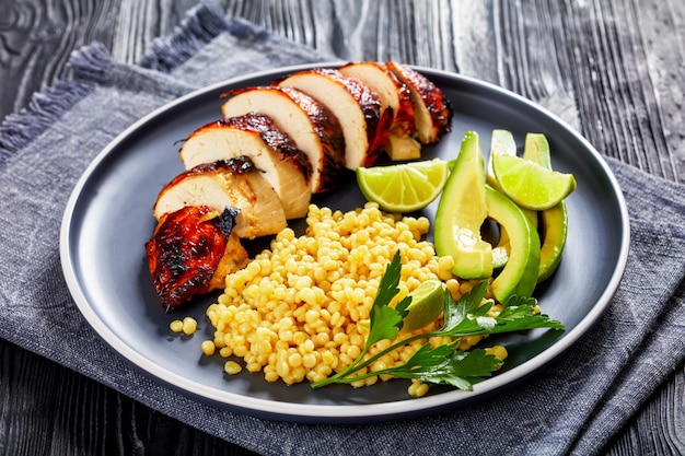 Grilled chicken breast with ptitim avocado lime