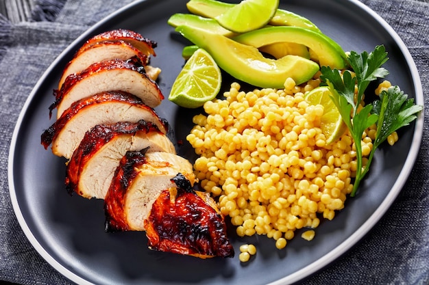 Grilled chicken breast with ptitim avocado lime