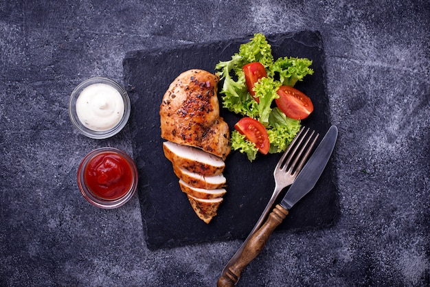 Grilled chicken breast with vegetable salad