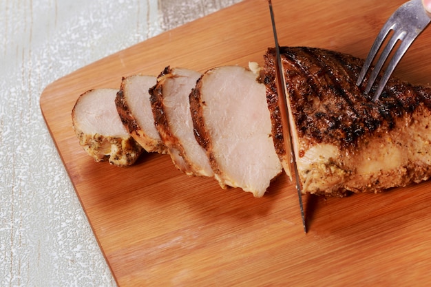 Grilled chicken on a cutting board