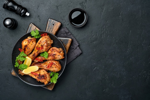 Grilled chicken drumsticks or legs or roasted bbq with spices and tomato salsa sauce