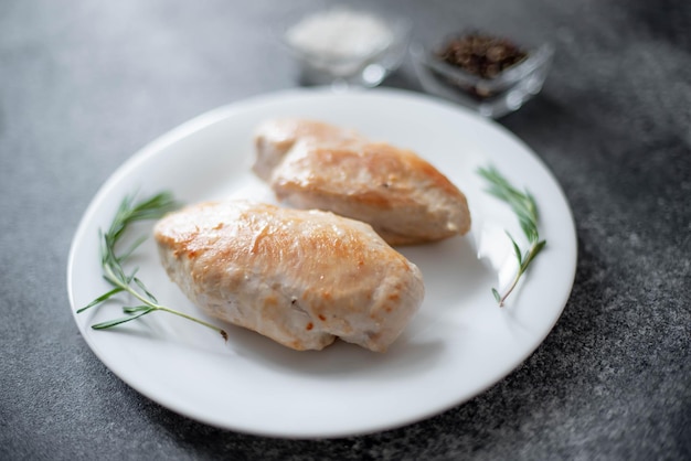 grilled chicken fillet on stone background