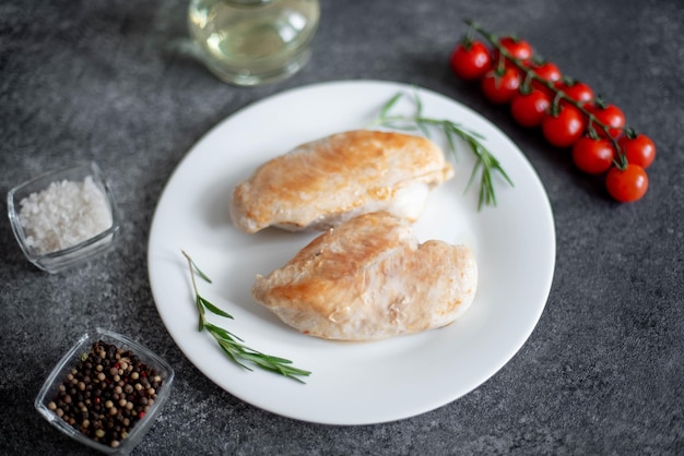 grilled chicken fillet on stone background