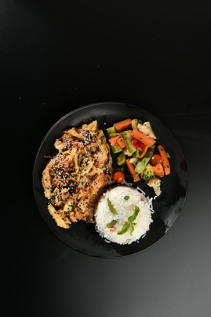 Grilled chicken . Fried chicken fillet and fresh vegetable salad of tomatoes,