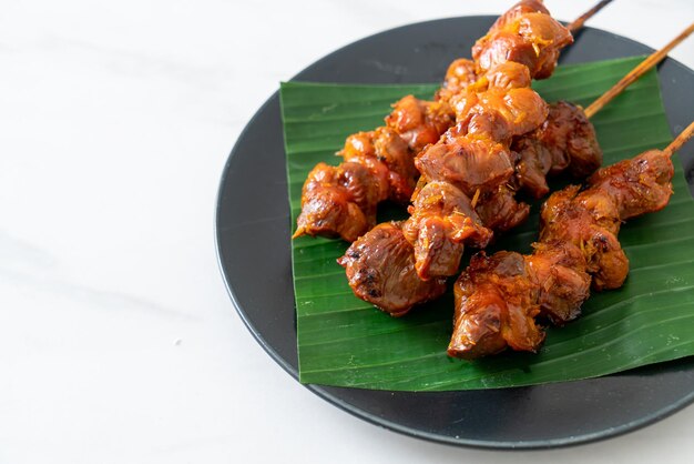 Photo grilled chicken gizzard skewer in asian style