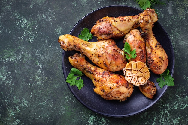 Grilled chicken legs with spices and garlic.