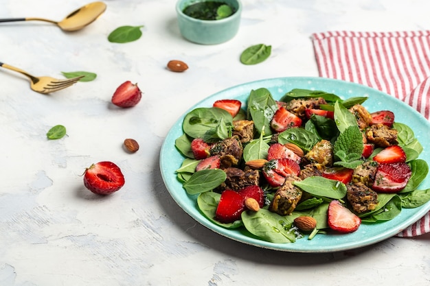 Grilled chicken liver, Strawberry and fresh vegetable salad of spinach, almond and mint