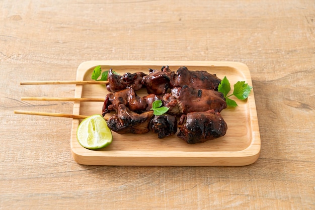 grilled chicken liver with herbs and spices on plate