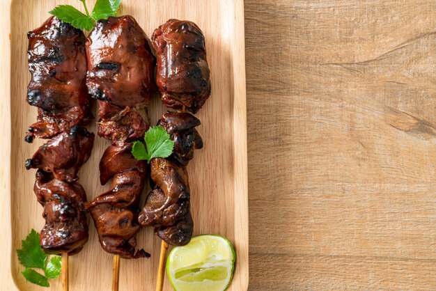 grilled chicken liver with herbs and spices on plate