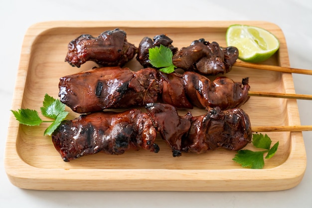 grilled chicken liver with herbs and spices on plate