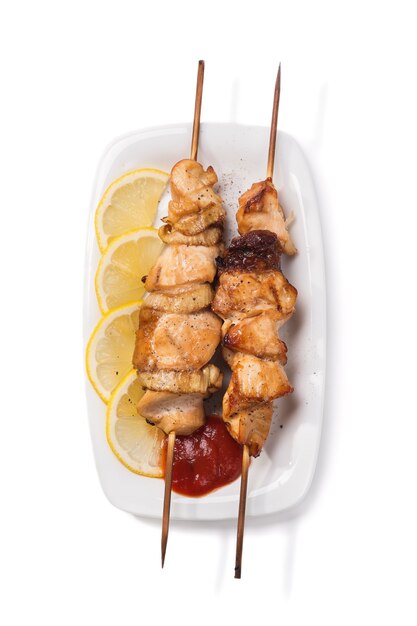 Grilled chicken meat on skewer