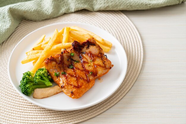 Grilled chicken steak with potato chips or french fries