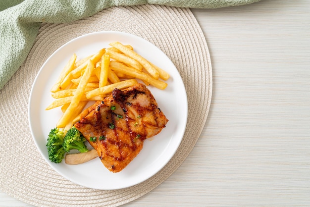 Grilled chicken steak with potato chips or french fries