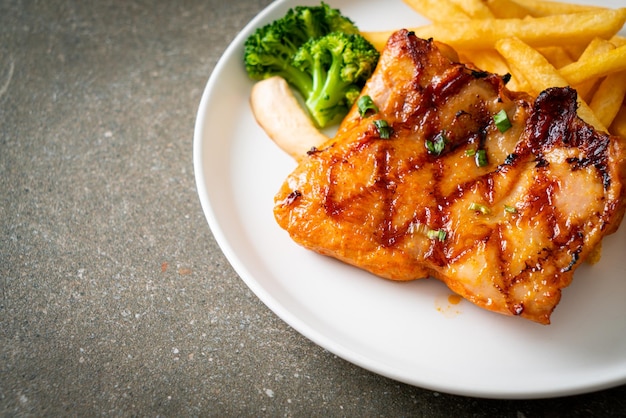 Grilled chicken steak with potato chips or french fries