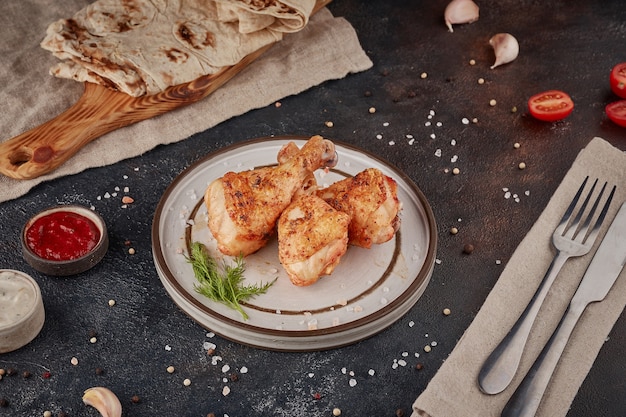 Grilled chicken, textured dark background