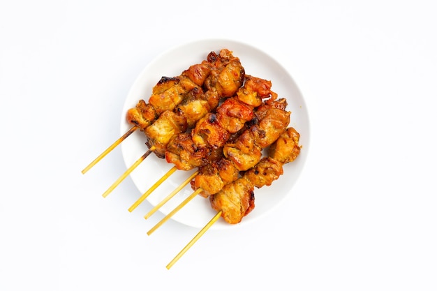 Grilled chicken on white background. Top view