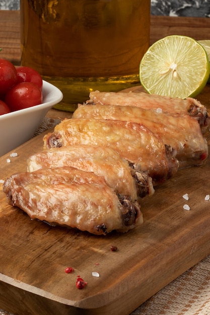 Grilled chicken wings on cutting board Selective focus