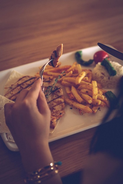 grilled chicken wings in sauce and delicious vegetables