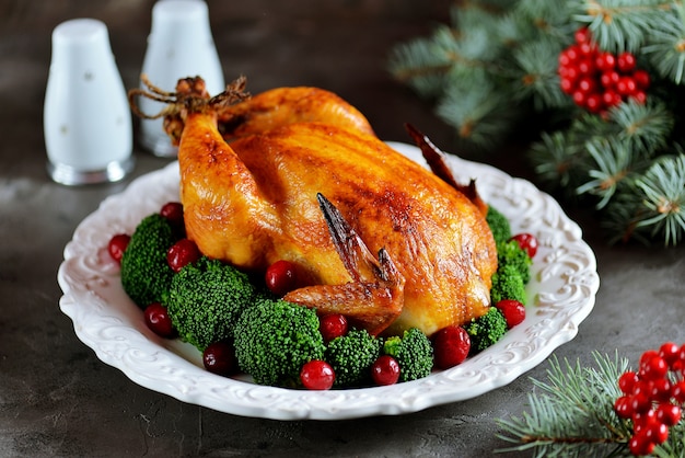 Grilled chicken with boiled broccoli and cranberries. 