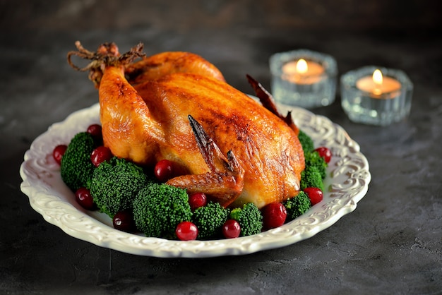 Grilled chicken with boiled broccoli and cranberries.