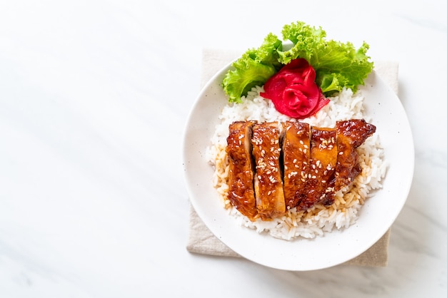 grilled chicken with teriyaki sauce on topped rice