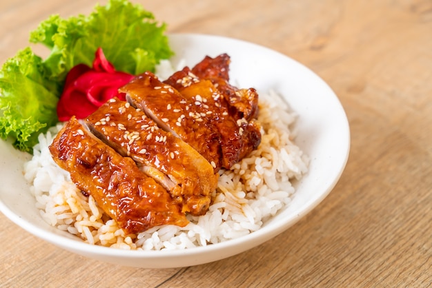 grilled chicken with teriyaki sauce on topped rice