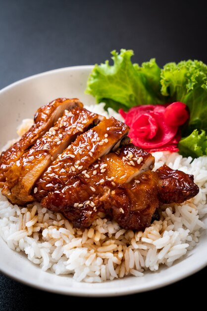 grilled chicken with teriyaki sauce on topped rice