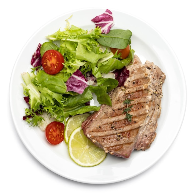 Grilled cooked piece of tuna fillet on ceramic plate isolated on white background