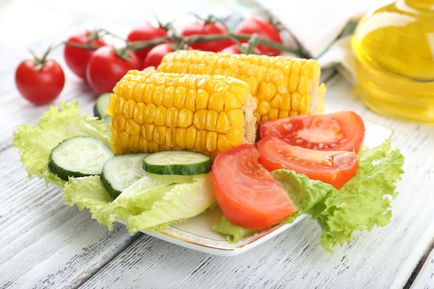 Grilled corn cobs on table, close-up