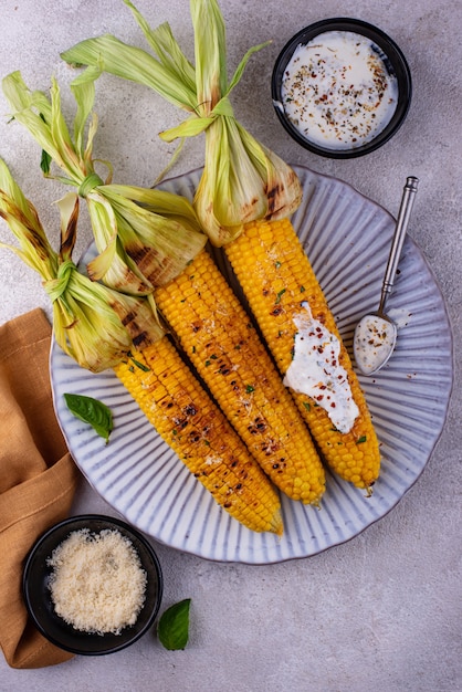 Grilled corn cobs with parmesan cheese