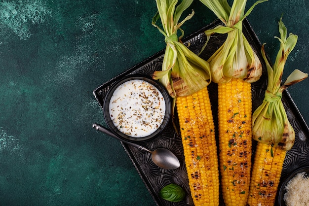 Grilled corn cobs with parmesan cheese